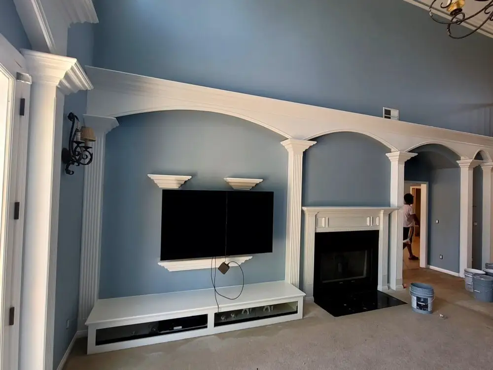 Interior repaint with crown molding and columns by Luminosity Painting
