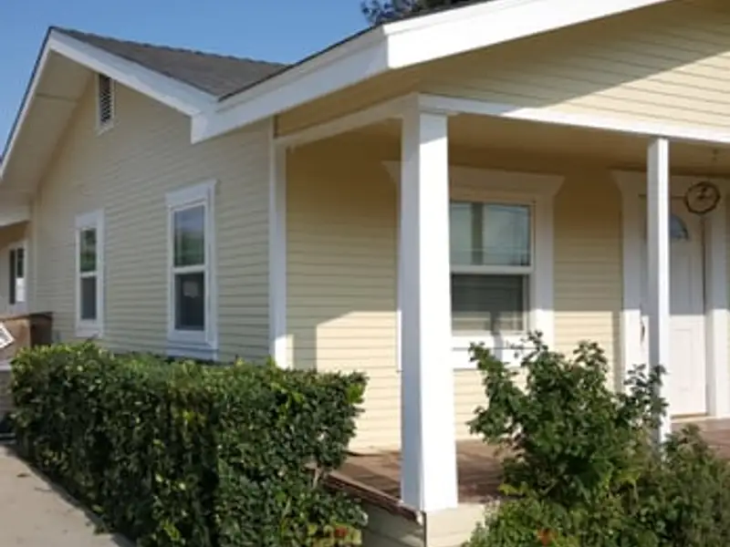 Home exterior repaint with fresh porch columns and trim